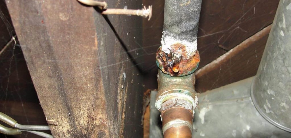 Galvanized steel plumbing leaking Rusty water drips from galvanized steel plumbing in the home